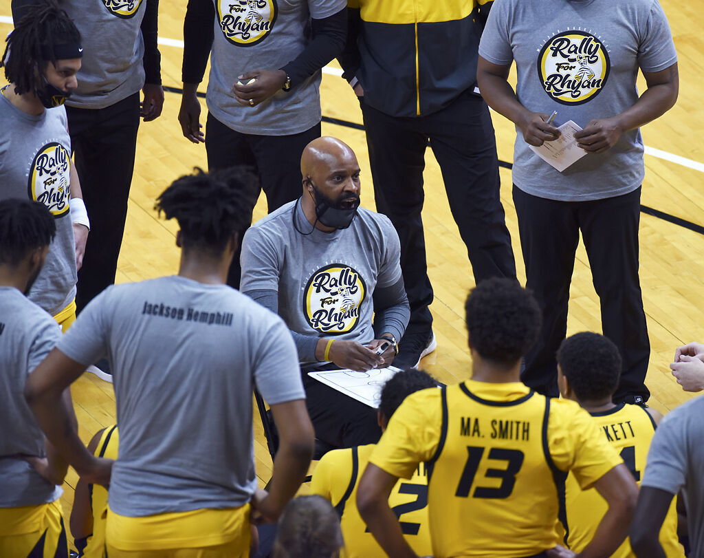 Cuonzo Martin draws game strategies on a whiteboard